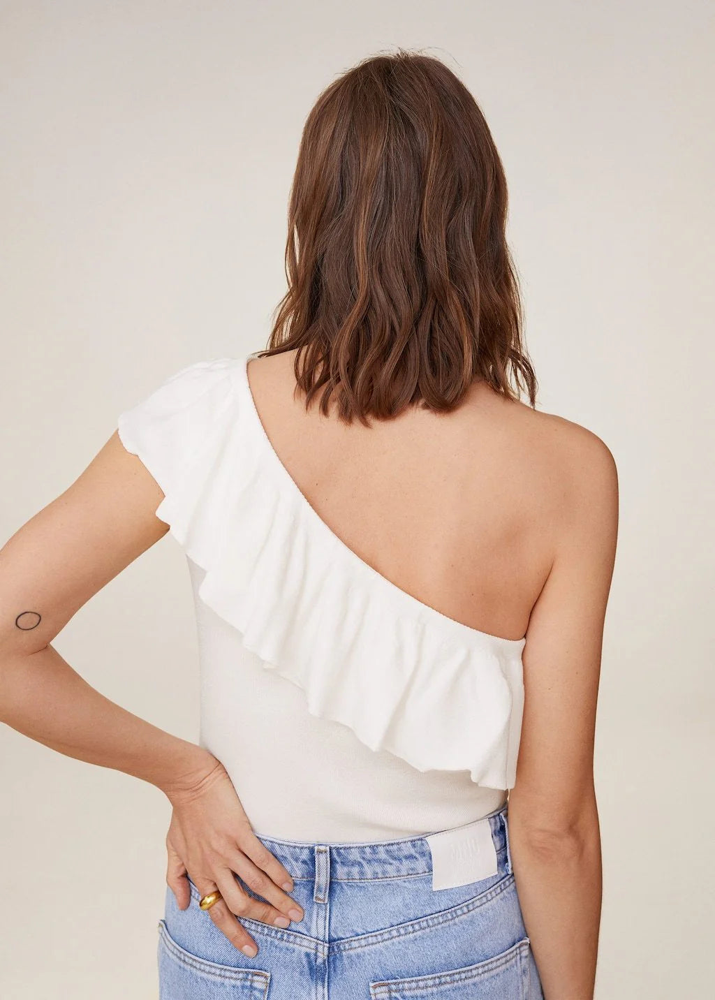 One shoulder white top